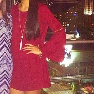 Red long sleeve dress with bell sleeves